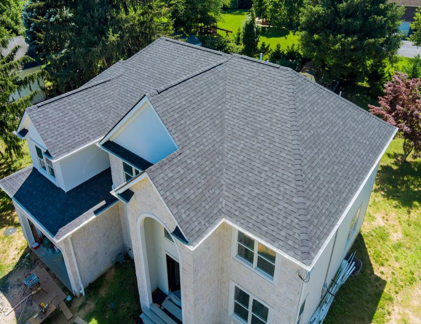 A house with a roof that has been covered in shingles.