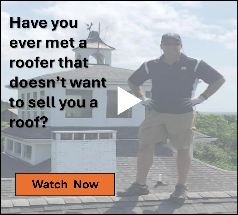 A man standing on top of a roof.