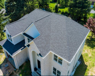 A house with a solar panel on the roof.