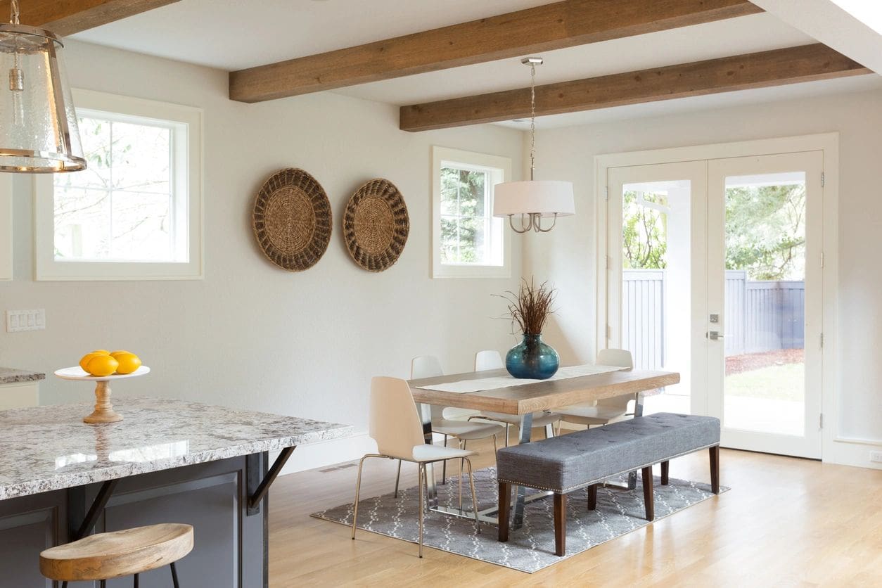 A dining room with two baskets on the wall.