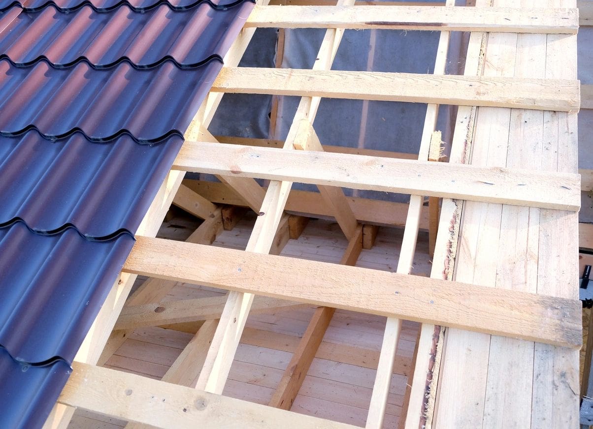 A roof with some wood and metal shingles