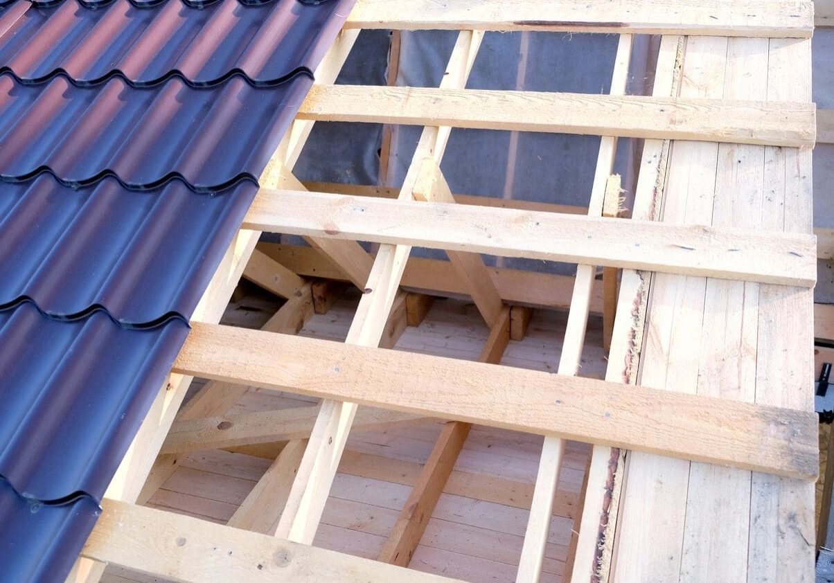 A roof with some wood and metal shingles